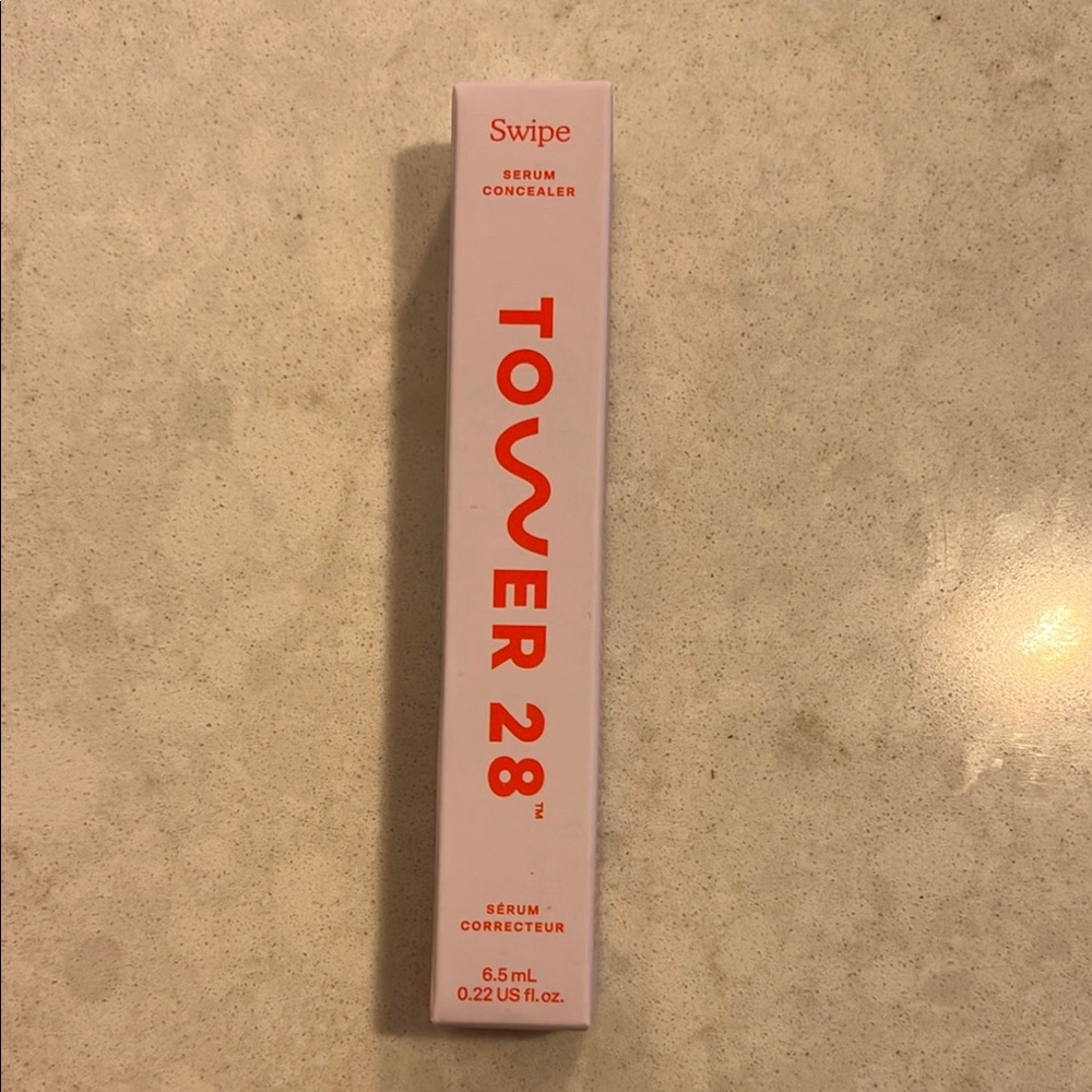 Tower 28 Swipe Serum Concealer with Red Text